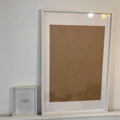 Two white picture frames