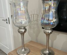 Pair of tall glass hurricane lamps