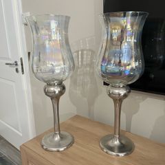 Pair of tall glass hurricane lamps