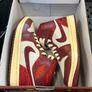 Air Jordan 1 Mid SE "Tiki Leaf" sneakers. The colorway is officially known as Team Red/University Red-Sail-Muslin Size 3 Image 2