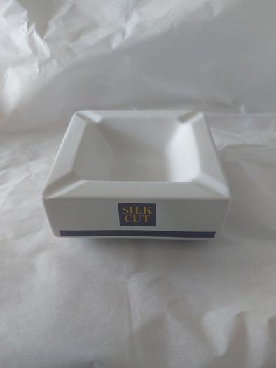 Silk Cut square ashtray ,collectors item, with smoking bans advertising bans on ashtrays for health reasons, price includes post to anywhere in Ireland thank you,,see pictures for condition ,take as is,litte pitting on glaze ,sold as is.