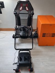 Logitech G920 racing wheel and seat, both in excellent condition.