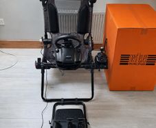 Logitech G920 racing wheel and seat, both in excellent condition.