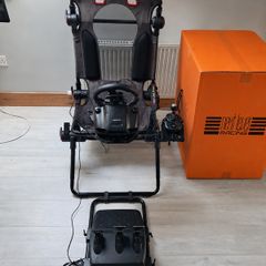 Logitech G920 racing wheel and seat, both in excellent condition.