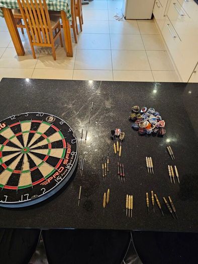 Dartboard + 7 sets of darts + spares - job lot