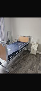 Electric hospital bed with mattress