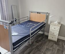 Electric hospital bed with mattress
