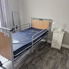 Electric hospital bed with mattress