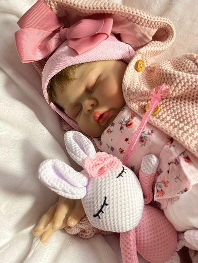 doll.       Reborn baby doll very cute COMES WITH A XMAS OUTFIT