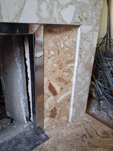 Tiled fireplace with chrome inner surround