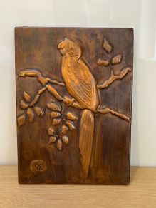 Vintage Copper hanging embossed image of a parrot marked RH c1960