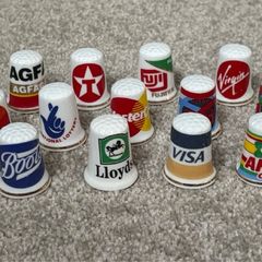 A Collection of Vintage Thimbles with Company Logos
