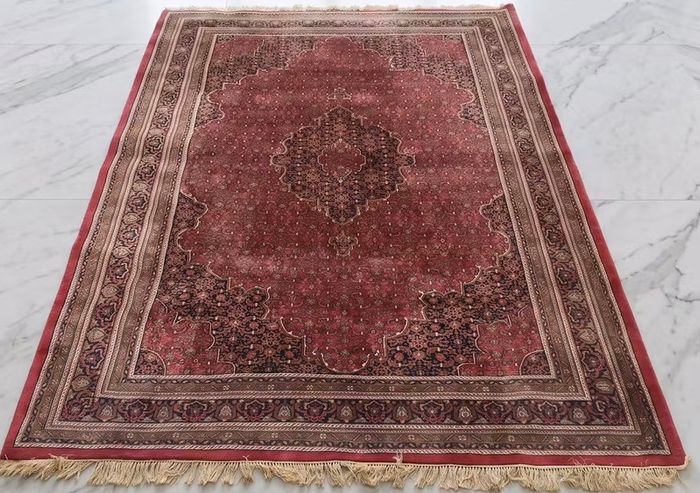 This is a good old hand knotted carpet with no wear