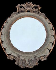 Large bevel edged mirror with ornate moulded frame.