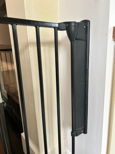 Black metal fire guard and safety gate
