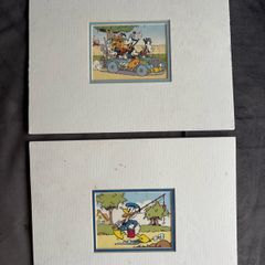 A Pair Of Sealed Mounted Vintage Donald Duck Prints