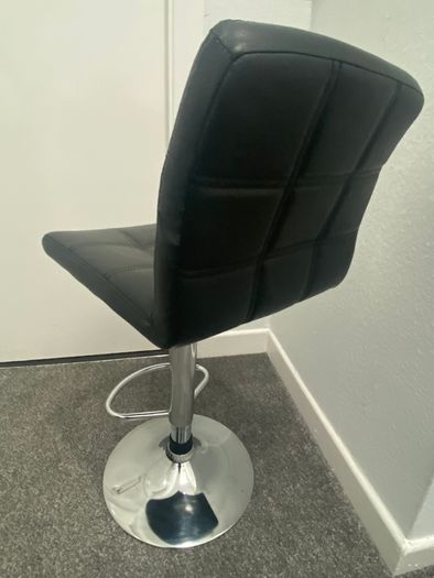 Black faux leather bar stool