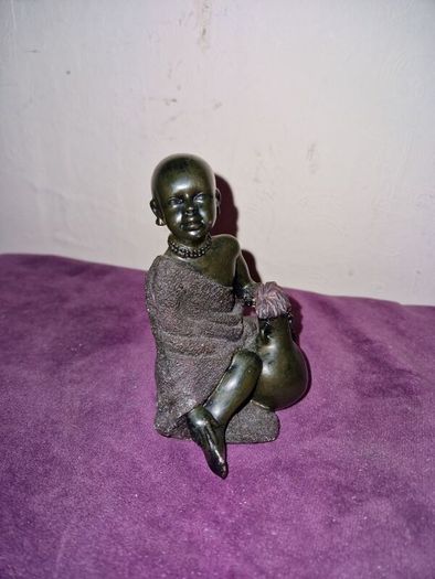 African child with water jug statue