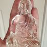 A glass Buddha figurine seated in the lotus position. Image 7