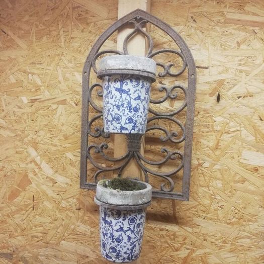 Vintage wrought iron plant hangers. Porcelain containers