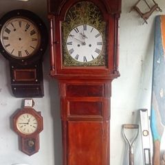 grandfather clock and wall clocks