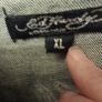 ED Hardy Denim Jacket.  More of a black/grey colour.  Fitted jacket.  Sleeves are long.  The decoration on the back is typical Ed Hardy Image 2