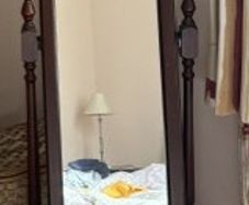 Freestanding cheval mirror with storage drawer