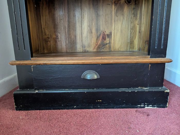 Tall black and wood bookcase