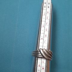 Silver ring clasping hands