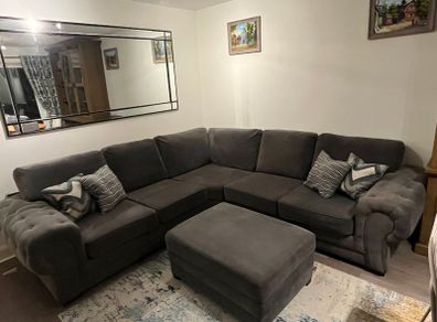 Grey corner sofa with matching footstool