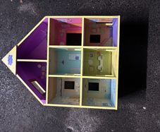 Peppa Pig wooden dolls house in good condition.