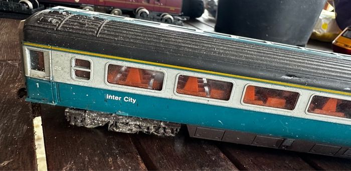 2 Hornby British rail engines and 2 British rail coaches. Don't have a controller so don't know if they work or not Hornby train