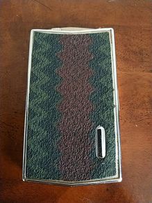 Metal cigarette box.