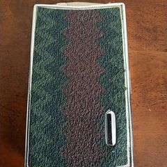 Metal cigarette box.