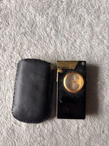 Vintage lighter with clock