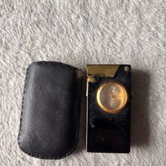 Vintage lighter with clock