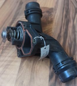 BMW thermostat with housing