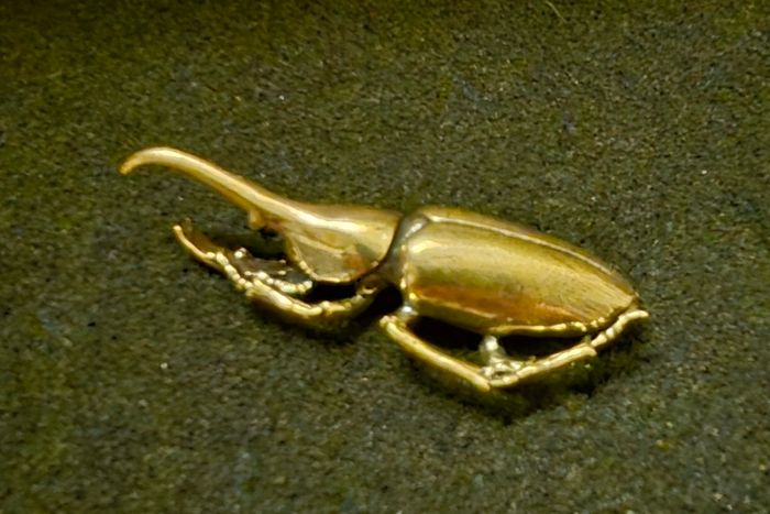 3 brass beetles.