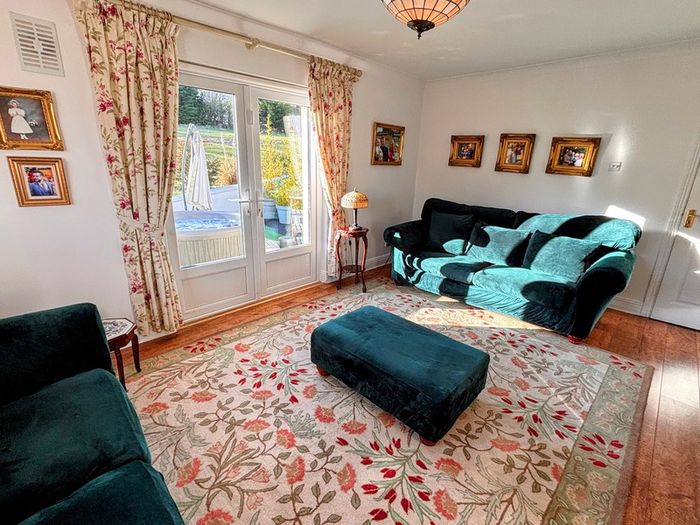 Elegant three piece suite with matching footstool