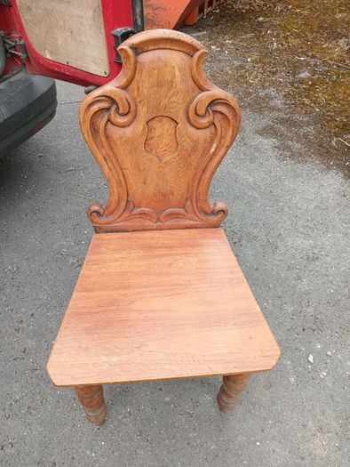 two oak chairs and an old  card table