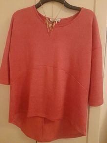 ladies deep pink top with added rose gold neck piece