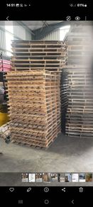 large quantity of used pallets