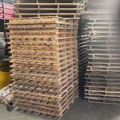 large quantity of used pallets