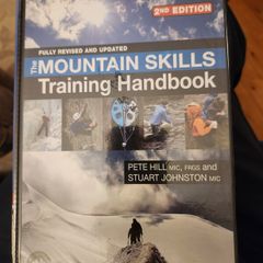 The Mountain Skills Training Handbook.  By Pete Hill & Stuart Johnston.  Hardback In Good Condition.