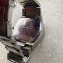 Kenneth Cole designer watch. Water Resistant. A few worn scratches but still working perfectly. Battery easily replaced and sits into the back of it. Image 6