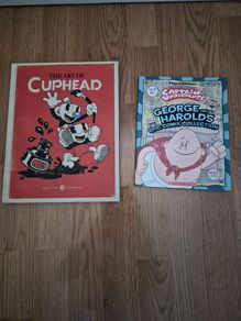 The art of Cuphead book and captain underpants comic book