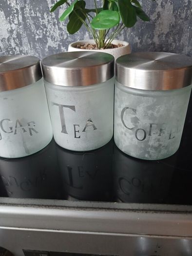 Bread bin and 3 Glass Canisters.