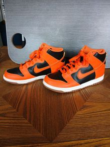 Orange and Black Nike hi tops