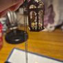 Vintage gilded bird cage with a bird pendant. Image 6