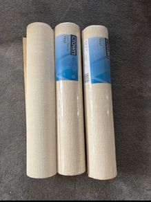 3 rolls of cream wallpaper